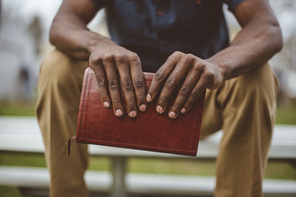 Hands holding Bible - Ministry background